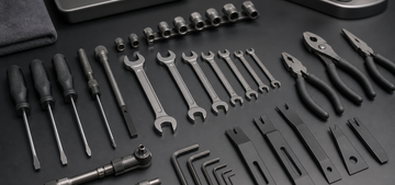 Organized motorcycle tools for fairing removal on a clean bench
